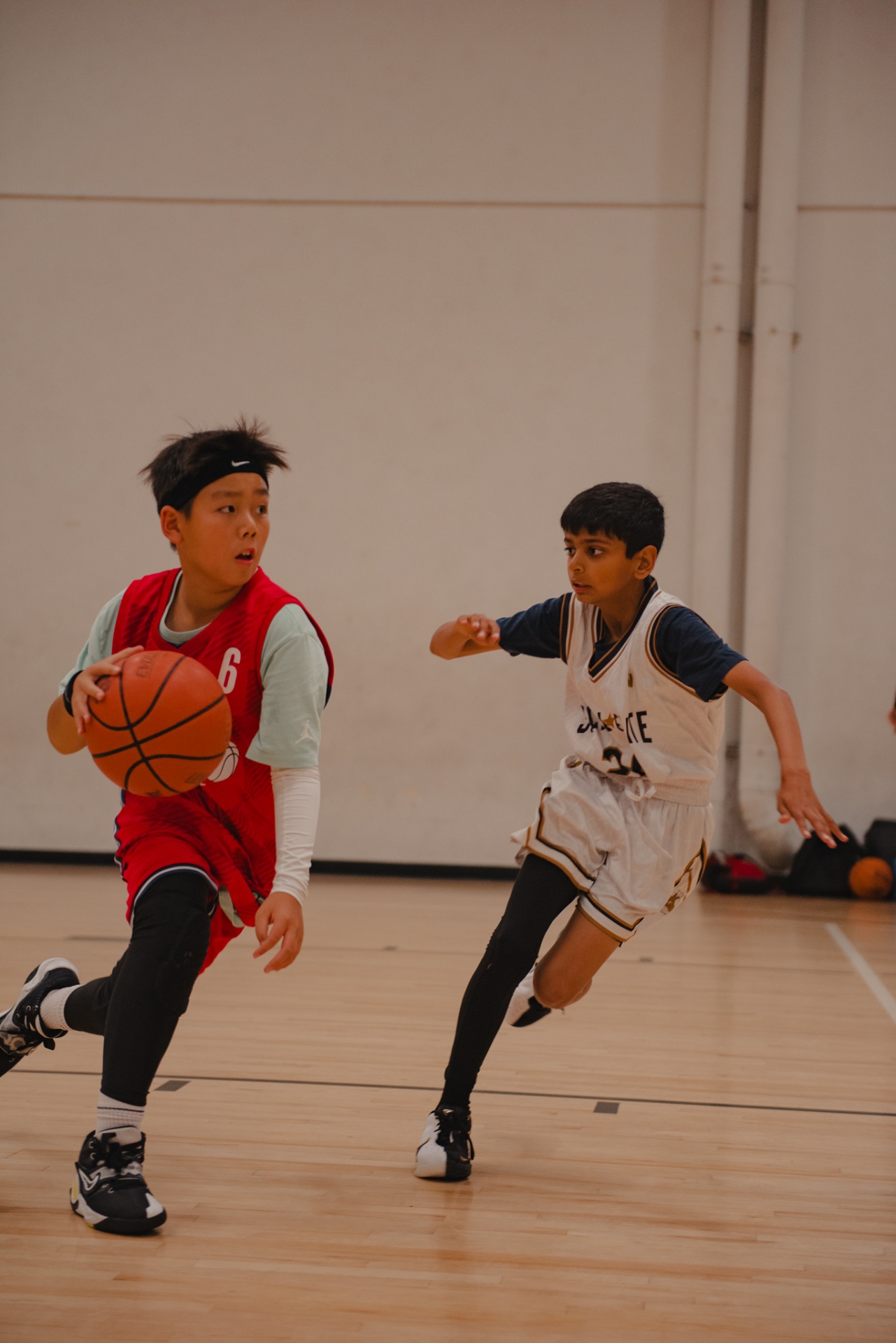 UYP club team player dribbling past defender in competitive game