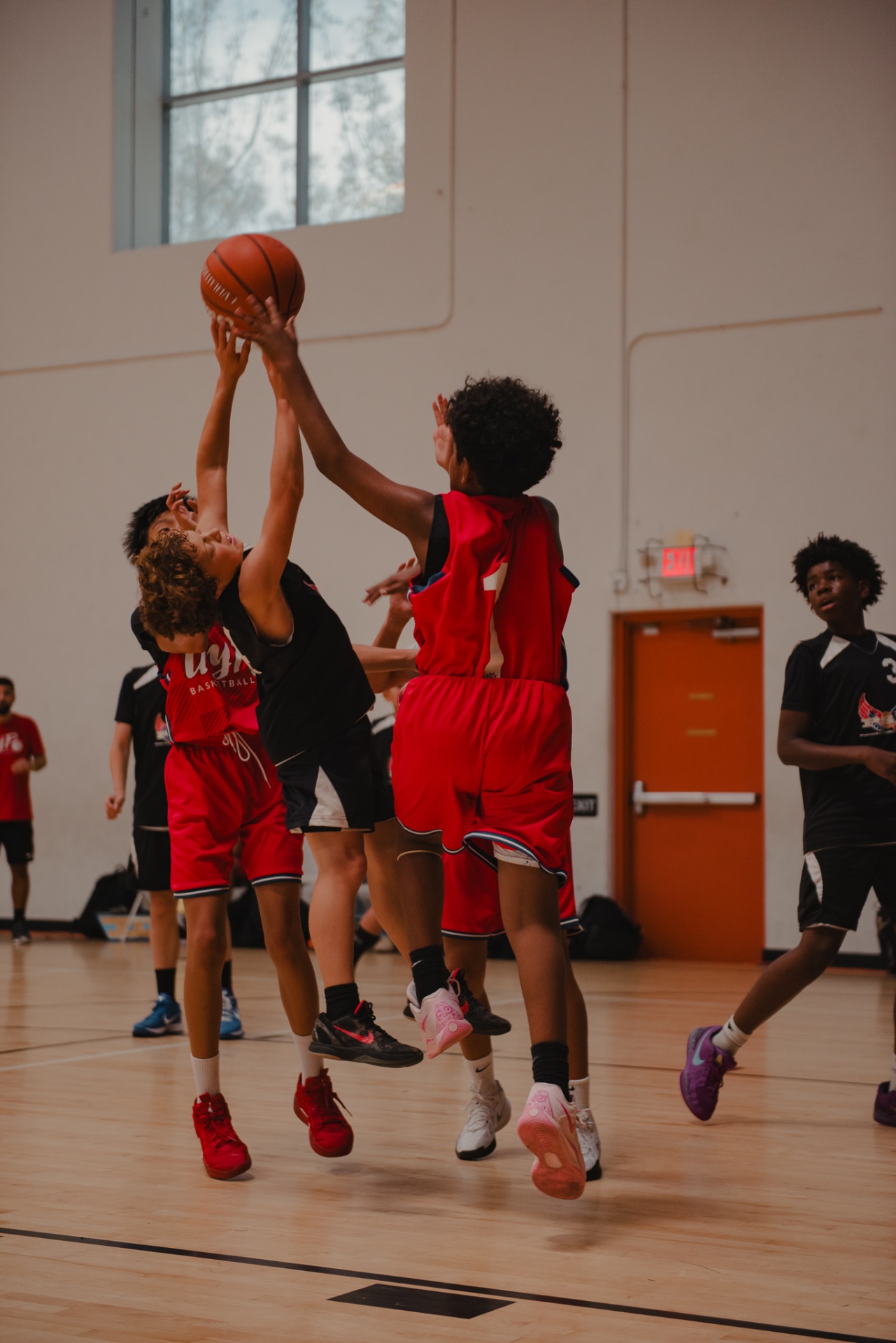 UYP basketball players competing for rebound at Irvine tournament